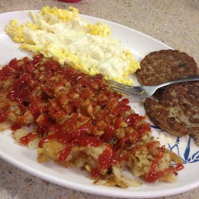 Pork sausage patties, cheese eggs, and hash browns.