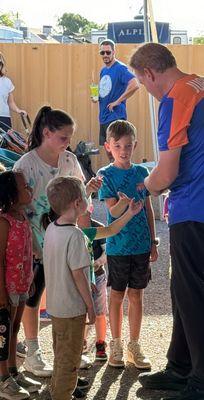 James Reid giving out his trading cards and stickers after a stage show at the 2024 Maricopa County Fair.