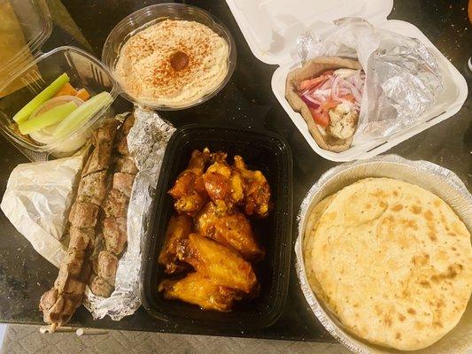 Hummus, wings, Chicken Gyro, pork skewers