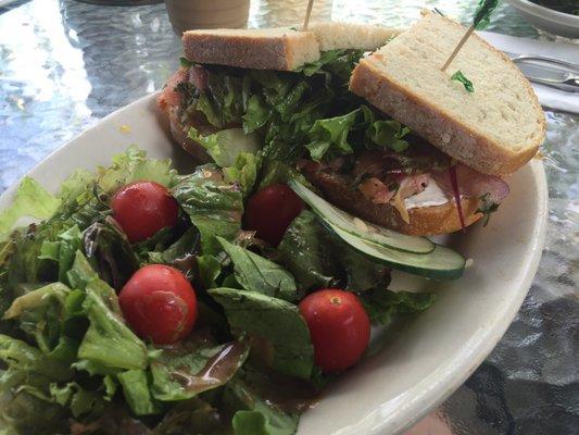 Salmon Tar Tar sandwich. Lox marinate with lemon and capers, with lettuce, onion, tomato, and cream cheese.