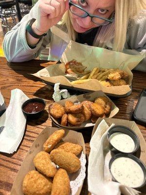 We got a salmon/avocado sushi roll, jalapeño poppers, fried pickles and chicken strips w fries.