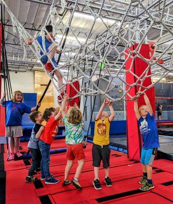 Ninja is for everyone even toddlers. Image shows toddlers enjoying the gym and trying to climb.