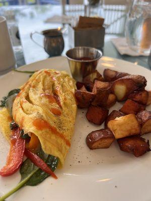 Chefs vegetable omelette (spinach, peppers and onions) with regular and sweet potatoes side of ketchup and I added hot sauce for some kick.