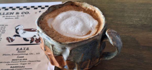 Standard cappuccino with whole milk served in locally made mug