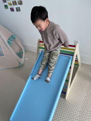 Down the slide he goes!