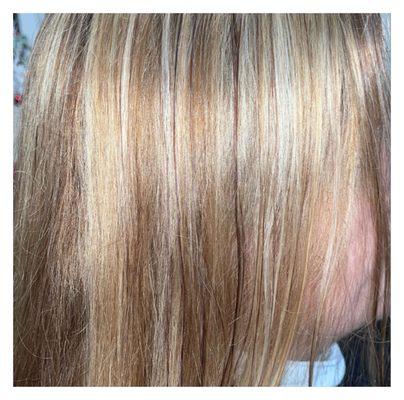 Natural blonde hair, with a lot of dimension and depth, with added highlights and lowlights .