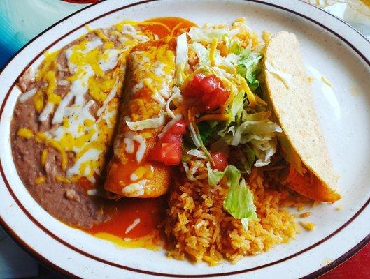 One chicken enchilada, one chicken taco, rice and beans!