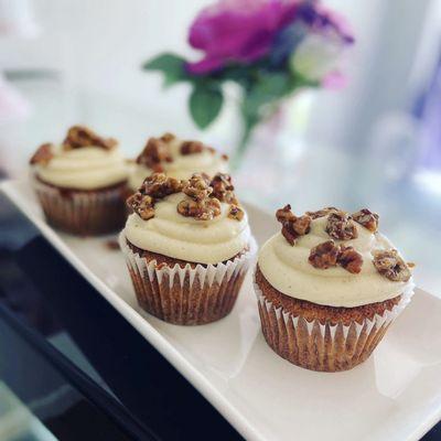 Hummingbird Cupcakes! Pineapple, banana and spice cake with a cream cheese frosting and candied pecans.