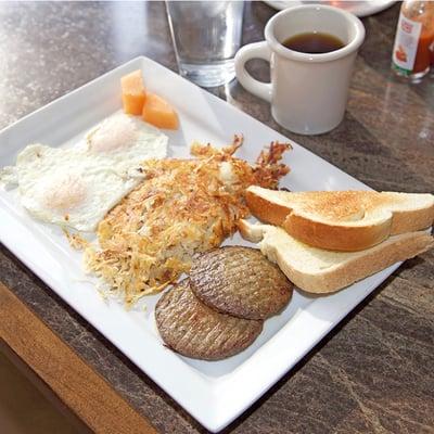 Airport Breakfast- 2 eggs with choice of ham, bacon, or sausage served with hash browns and toast or biscuit