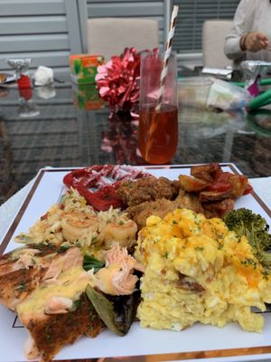 Shrimp & crab grits, scrambled eggs, sautéed veggies, salmon cakes, fried chicken, home fries & red velvet waffles