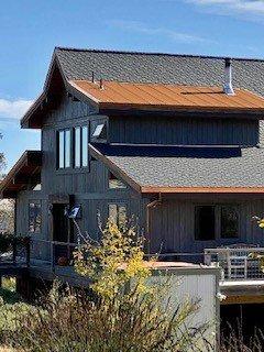 Metal and composition shingle roof