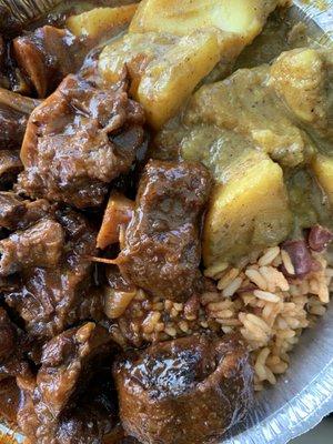 Oxtail stew with curries potatoes and rice&beans.