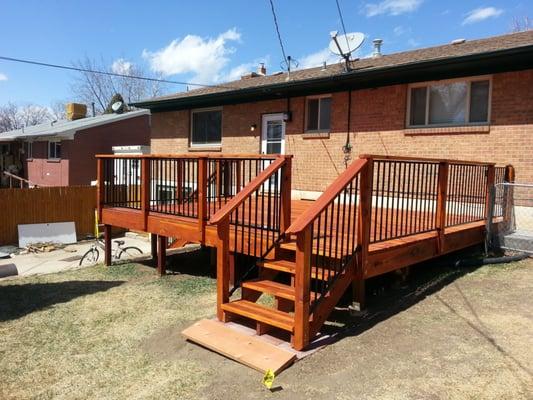 New Deck After.
 New redwood with Fortress railings.
 Sikkens SRD redwood tone