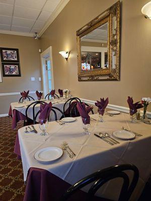 An elegant table set-up with a beautiful wall mirror.