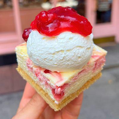 Cherry Pie Cheesecake Bar! Amazing Cheesecake Baked w/ Cherry Pie Baked on top of Shortbread Cookie Decorated w/ Fresh Whip Cream!