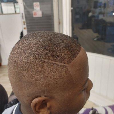 High bald fade with a part on the side