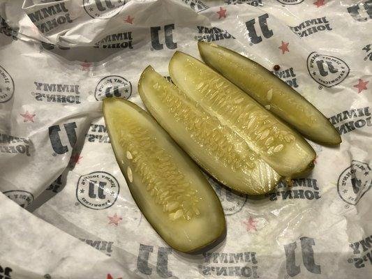 Sliced jumbo kosher dill pickle.