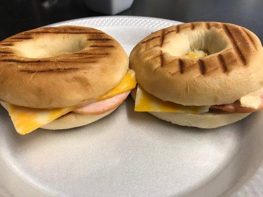 Canadian bacon and cheese bagel breakfast sandwich