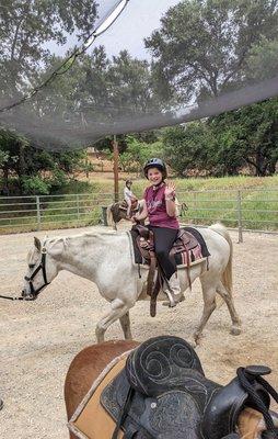 Grand daughter enjoying her ride on Sage