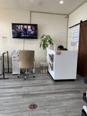 Front desk area and two nail stations to the left.