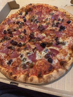 Salami and olive pizza well done