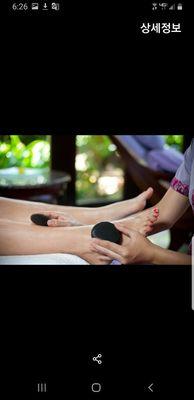 Foot massage with hot stone