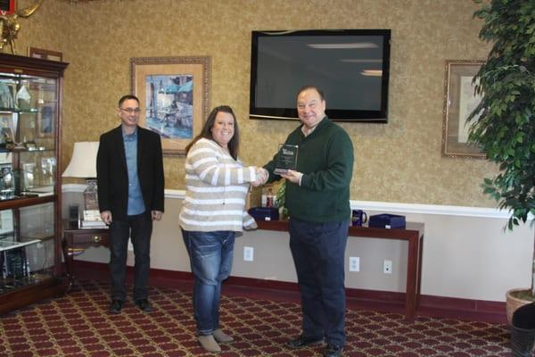 Melinda Prehoda is presented with a million $ production award for 2014. Pictured (left to right) Steve Nichols, Melinda Preh...