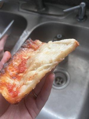 Undercooked Small Gluten Free Deep Dish Pizza. We pulled the cheese off to show the raw dough underneath