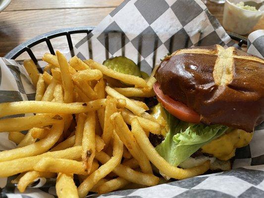 Cheeseburger deluxe Cole slaw and fries.