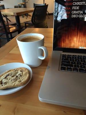 Americano and chocolate chip cookie.