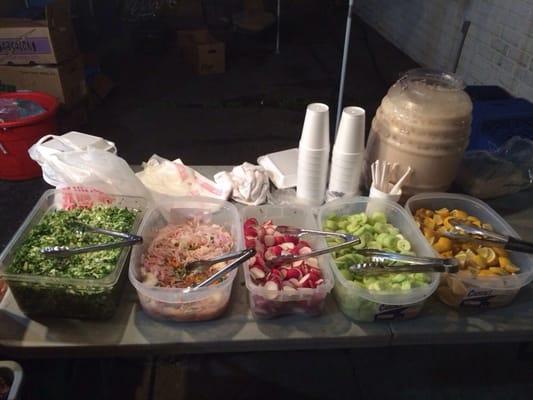 Horchata, salsas, radishes, cucumber and onion. There are a few other salsa choices to the right, unseen