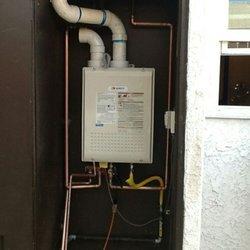 Latest technology Noritz 9.8 gallon condensing tankless water heater installed in an outdoor closet.