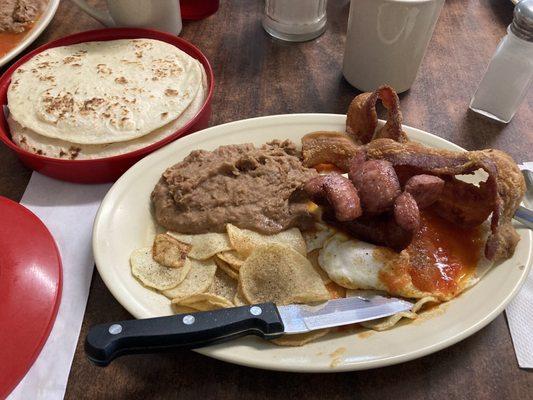 Huevos Rancheros with sausage and bacon