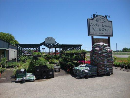 Main sign and some of the smaller ornamental plants & veggies, adjacent to Highway 10.