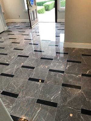 Foyer marble floor restored to a high polish finish.