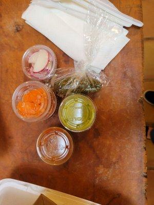 Salsa bar with radishes, pickled jalapeño & carrots. SPICY GOODNESS!