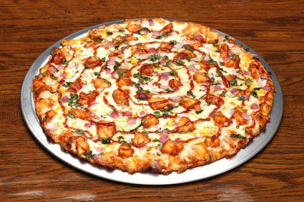 Rusty's BBQ Chicken Pizza - White chicken marinated in tangy BBQ sauce topped with fresh red onion & cilantro.