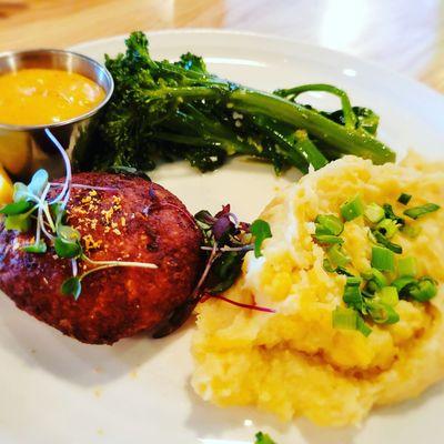 Crab cake, broccolini, and mashed potatoes