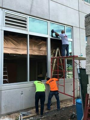 Our team working at Memorial Hermann relocating window louvers and removing curtain Wall system.