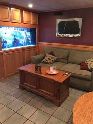 They have some cozy seating and a fish tank in the back.