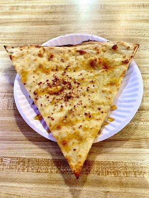 White pizza with spicy honey and red pepper flakes.