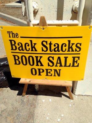 Be sure to check out "The Back Stacks"! Lots and lots of books for sale.