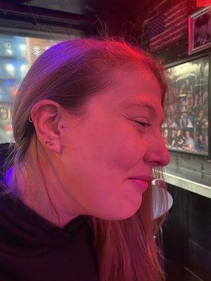 Fresh tragus & helix piercings. The lobes were done years ago, also here at Whatever Tattoo.