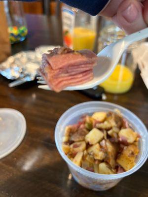 That's the thin sliced "supposedly" corned beef that sat on top of one of the SIX containers we bought. Wasn't even mixed in the potato!!!!!