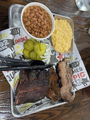 Three meat platter with pork, beef ribs, and brisket.