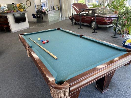 There's even a pool table customers can use while they wait!