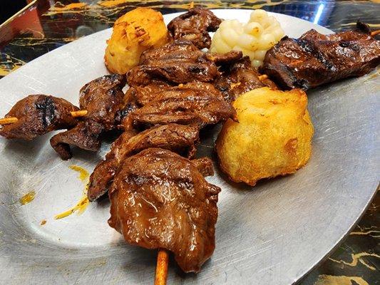 Anticuchos (grilled beef hearts)