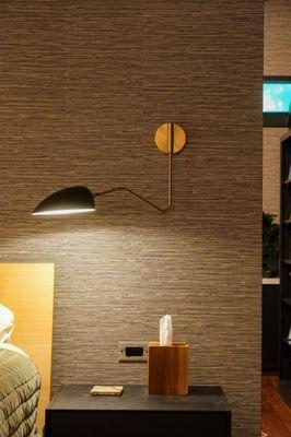 Texture grass cloth wallpaper with modern lighting.