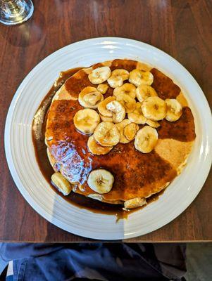 Cathedral pancakes with pecan syrup and bananas foster topping