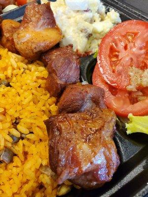 Carne Frita with Arroz con gandules (Fried porl cubes with yellow rice and pigeon peas)